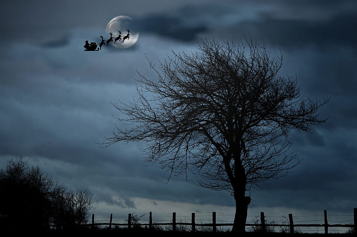 Santa driving his sleigh across the night sky