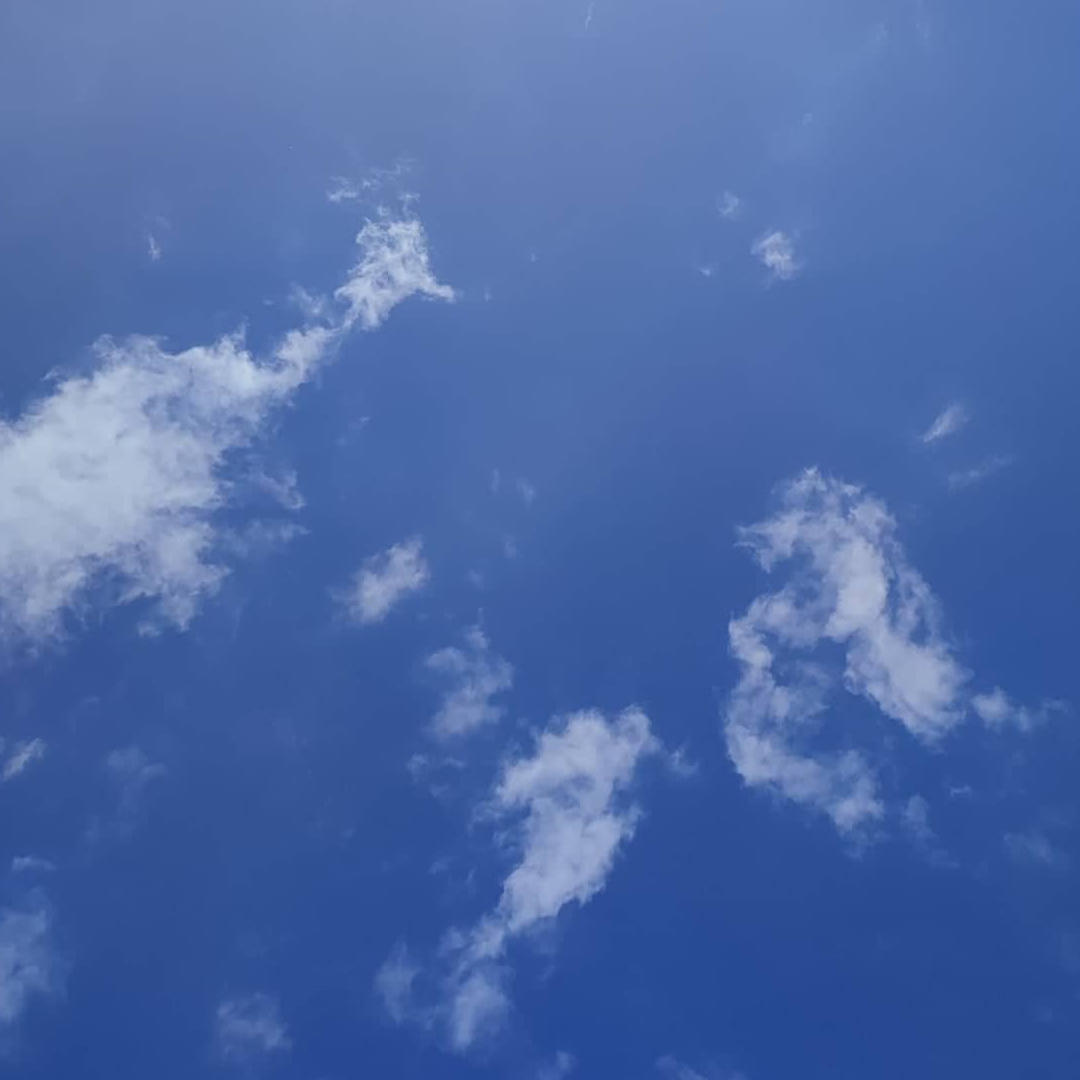 Blue sky with wispy clouds