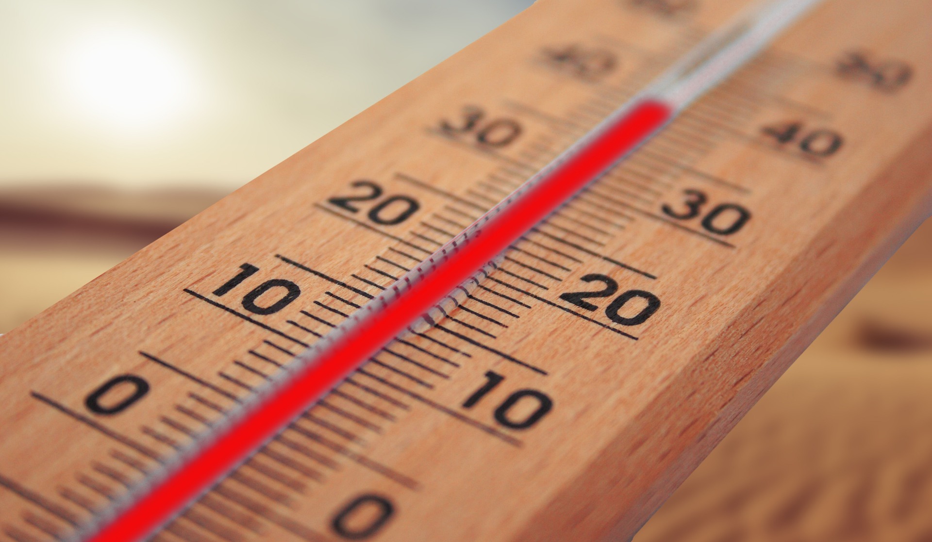 Mercury thermometer showing temperature reaching near 40 degrees celsius.