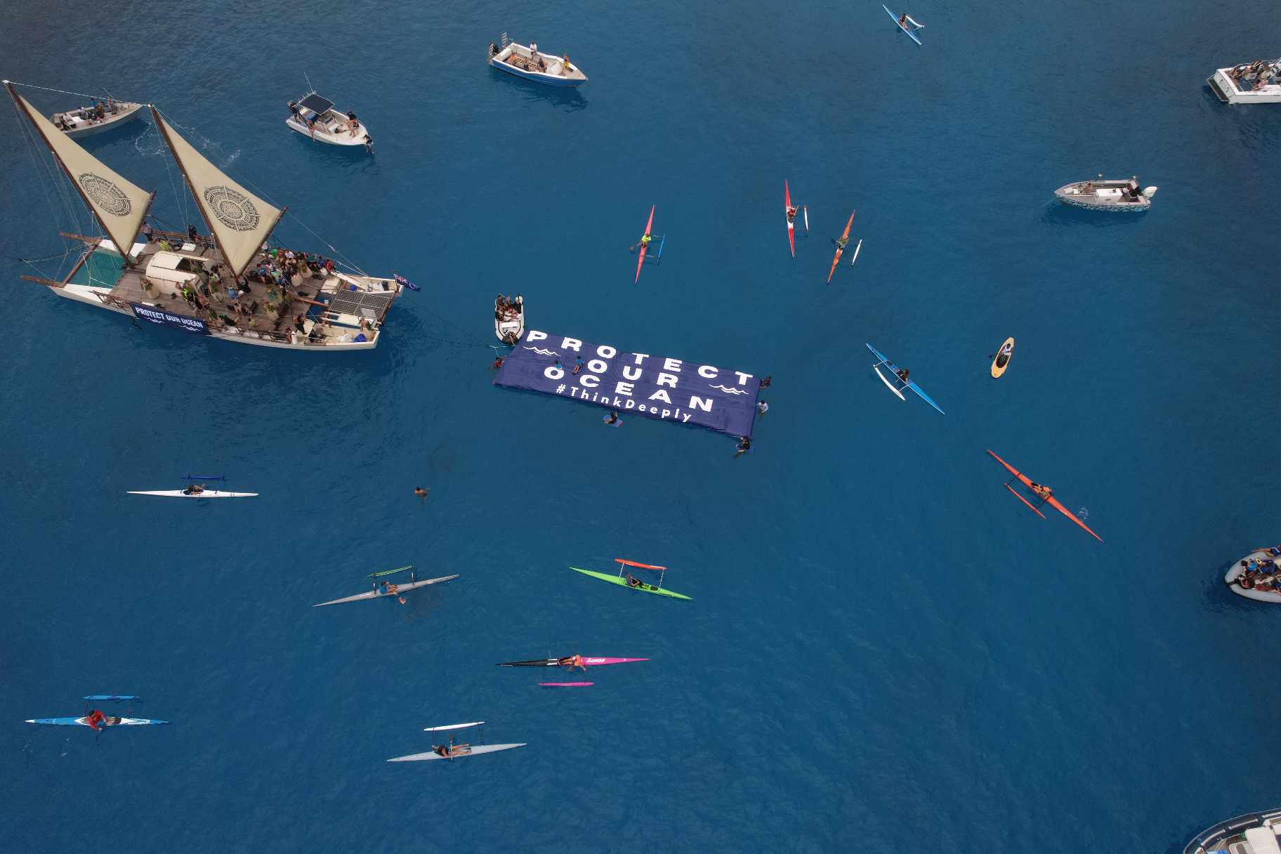 Aerial shot of Ocean Ancestors' on-water rally against deep sea mining.