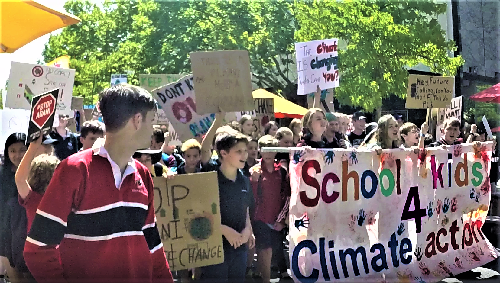 Student Stikers with joy march with placards and banners