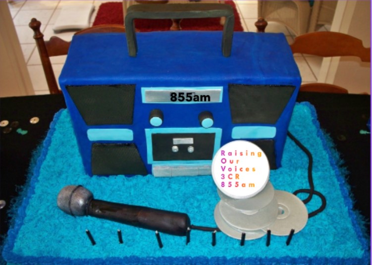 Blue Ghetto Blaster Birthday Cake with Microphone and CDs representing Raising Our Voices on 3CR Radio