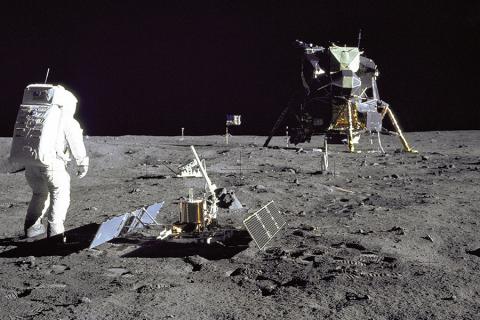 Buzz Aldrin with some of Apollo 11's scientific equipment. In the foreground is the Passive Seismic Experiment Package, and behind it is the Laser Ranging Retro-Reflector (Photo taken by Neil Armstrong, NASA)