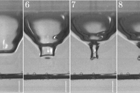 Underwater view of a droplet hitting a water surface, forming a resonant bubble (Image Phillips et al., Scientific Reports)