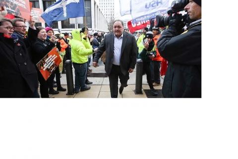 Former Canberra Raider player and CFMEU official John Lomax is cheered on by supporters. Picture: Kym Smith 