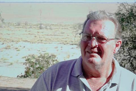 Barry Stone: Employment Agent, lives on Lake Menindee in NSW.  Behind him is 15 kilometres of dry lake-bed to the other side. 