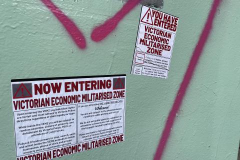 Stickers pasted up around the designated Police Special Powers Zone in Docklands this week at the site of the 2024 Land Forces Expo.